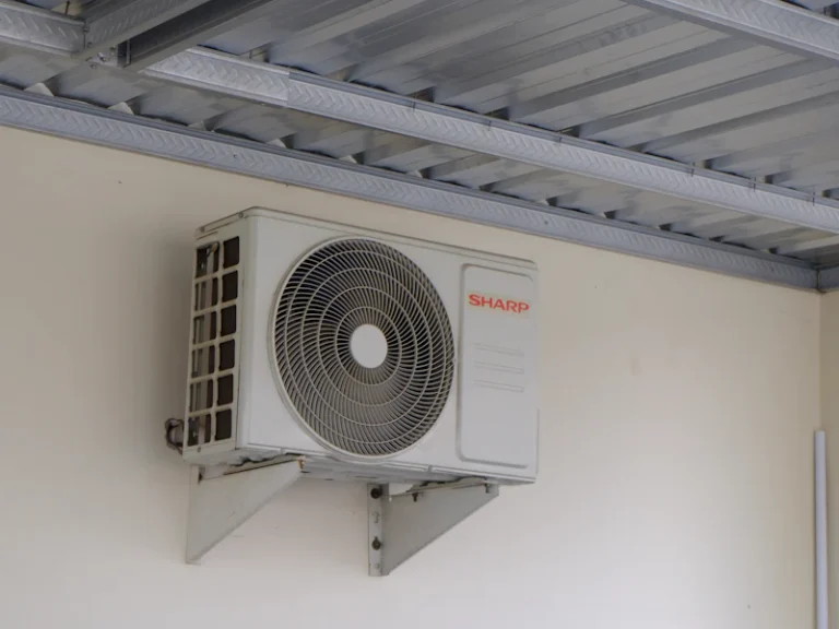 AC outdoor unit installed on a wall bracket